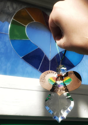 "His banner over us is love" -  rainbow heart angel ornament/suncatcher